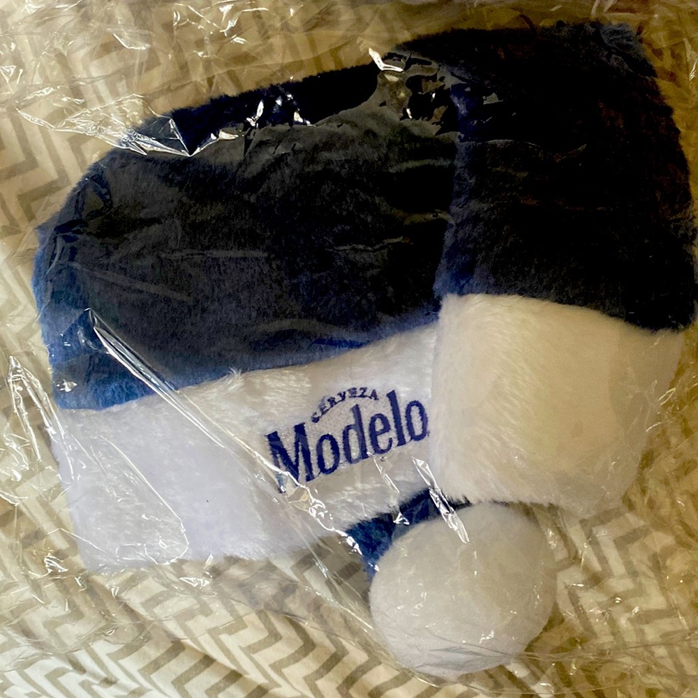 Blue “Modelo” Santa hat in packaging